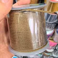 Hand-held spool of brown 2mm braided nylon cord for DIY jewelry making and crafts - Brown Yellow