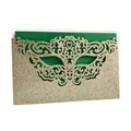 Detailed view of laser-cut glitter paper party invitation featuring a mask design - Set with Dark Green Inner Card / Light Gold Glitter