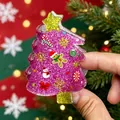 Detailed view of a pink glitter Christmas tree hair claw clip featuring festive charms - Pink Christmas Tree