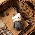 Adorable plush cat pendant keychain accessory for bags and backpacks in a warm basket - Striped Fabric Cat (White)