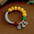 Handcrafted ethnic style agate bead bracelet featuring yellow stones and a silver crescent charm - Curved Tube Imitation Amber Style / Yellow