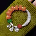 Vintage ethnic style agate bead bracelet featuring silver charms and curved metal tube - Curved Tube Imitation Amber Style / Red