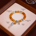 Retro ethnic style bracelet with amber-colored beads and silver charms - Little Fortune God Tassel Style / Abacus Bead Style / Amber