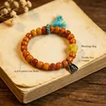 Vintage ethnic ox bone bead bracelet featuring Zaji Lhamo pendant and yellow lucky bag charm - Fortune Bag Triangle Pendant Zhajilamu Style / 9.4x6.3mm Bead Diameter / Amber