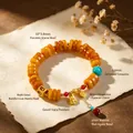 Retro ethnic style yellow beaded bracelet with Zaji Lhamo charm and red agate beads - Imitation Amber Spacers: Four-faced Buddha & Zaki Lhamo Bracelet