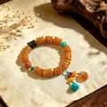 Retro ethnic style beaded bracelet with orange ox bone discs and agate pendant charms - Imitation Amber Spacers: Peace Buckle Pendant Bracelet