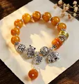 Ethnic style beaded bracelet with faux amber beads and silver lucky cat charm - Imitation Amber Spacers: Blessing Gathering Bracelet