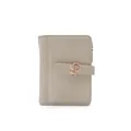 Detailed close-up of a stylish beige PU leather wallet featuring a rose gold leaf buckle - Green