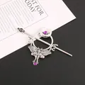 Detailed close-up view of vintage silver hair pin with moth and crescent moon design - Antique Silver