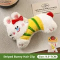 Adorable white plush bunny hair clip featuring a red bow and yellow striped shirt accessory. - Striped Rabbit Doll - Hair Clip