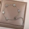 Silver titanium steel bracelet with five ribbed flower charms and adjustable chain - Steel