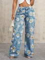 Detailed view of high-waisted wide-leg denim jeans featuring floral daisy and text print patterns - S / Bottoms / Daisy
