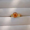 Close-up view of gold stainless steel ring featuring a real orange dried flower cabochon - Gold Base Orange Dried Flower Style(2) / Orange