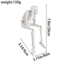 Sitting resin skeleton figurine for Halloween decor with dimensions 7.8 x 3.5 in ornament - Hear-No-Evil Style (D1-13)