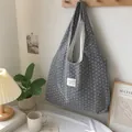 Detail of a grey tote bag with white star pattern hanging in a cozy lifestyle setting - Grey with Small Stars