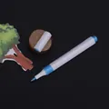 Blue acrylic paint marker with white triangular barrel and precision tip. - Brush Tip / Sky Blue