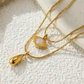 Detail view of double-layer titanium steel necklace with evil eye and water drop charms - Angel Eye (X334) / Gold