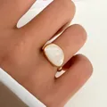 Vintage gold-plated alloy ring with white pearlescent drip oil inlay worn on index finger - White Irregular Enamel (K-845) / Gold