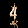 Golden number 4 birthday cake candle featuring a crown top and sparkling gold bow decoration - Crown Bow Number 4 / Champagne