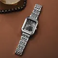 Close-up detail of a silver rectangular ladies watch with black dial and steel strap. - Square Watch (M1620) / Black Dial Silver Case