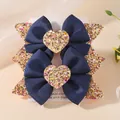 Pair of navy blue ribbed bow hair clips with gold glittery heart centers - Sequin Heart Bow (2A-1)