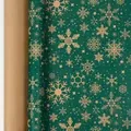 Premium green Christmas wrapping paper roll featuring festive gold snowflake and star patterns. - Green Background Snowflakes / 43*300cm Roll