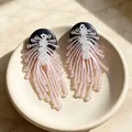 Vintage-style pink and clear beaded drop earrings with black circular studs - Wood Pink Crystal Beaded Tassel Firework Earrings (2608106)