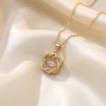 Detail showing a gold-toned necklace pendant with pavé zircons and a central marquise stone. - Intertwined Hollow Flower Style (X1532) / Gold