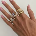 Set of fashionable gold-plated rings with colorful square gemstone accents on hand - 7-Piece Purple and White Rhinestone Ring Set / Gold (07431)