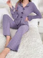 Two-piece purple ribbed pajama set with elegant black bow accents and long sleeves - Purple