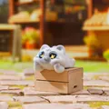 Adorable grey and white cat figurine with sparkling star eyes lying on a tiny wooden box - Little Tabby Cat (3253) / Off-White