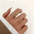 Elegant silver double interlocking circle ring with pave cubic zirconia for women - Double Ring Intertwined Style / Silver