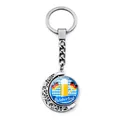Silver metal Oktoberfest keychain featuring a rotating moon pendant with beer festival theme - Beer Festival Logo with Flag (JY008652-4)