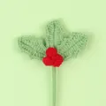 Close-up of handmade crochet holly leaves and red berries Christmas decoration - Red Berry Stem / Bean Green