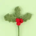 Detailed view of handmade crochet Christmas holly leaves and berries decoration. - Red Berry Stem / Light Green