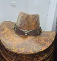 Vintage distressed brown western cowboy hat with metallic bull head ornament for outdoor travel - Bull Head Crack / Orange