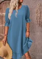 Vintage style blue cotton linen dress with puff sleeves and ruffled hem for summer look - Teal
