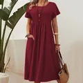 Woman in a dark red cotton linen midi dress with pleated details and side pockets - 5XL / Dresses / Burgundy