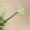 Detailed view of traditional Chinese sandalwood hair stick with green flower and tassel - Blue Butterfly Light Green Flower Artificial Pearl Tassel Style (8472)