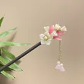 Detailed view of an ancient style sandalwood hair stick with pink floral tassels. - White Sakura Lily of the Valley Artificial Pearl Tassel Style (8128)