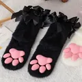 Black fuzzy over-the-knee socks featuring pink 3D silicone cat paw pads and ribbons - Black