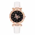Detailed view of women's quartz watch featuring butterfly motif dial and white strap - White