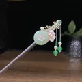 Elegant Chinese sandalwood hairpin with jade-like disc, pink flowers, and bead tassels. - Green Jade Disc Golden Pipa Tassel Style (0663)