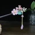 Elegant sandalwood hair stick with pink resin flowers and golden tassel detail. - Pink & Green Floral Leaf Artificial Pearl Tassel Style (1277)