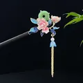 Handcrafted ebony wood hair stick featuring pink floral decor and green jade ring tassel - Green Jade Ring Pink Flower Blue Leaf Tassel Style (1795)