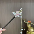 Vintage sandalwood hair stick featuring a pink butterfly flower design and pearl tassels - Pink and White Butterfly Tassel Step-Shake Style (2346)