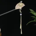 Elegant wooden hair stick featuring a pink fan, golden flower, and dangling tassels. - Pink Transparent Fan Pearl Tassel Style (发簪2368)