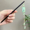 Elegant sandalwood hairpin featuring a green bead tassel and landscape charm - Ancient Figure Painting Green Bead Tassel Style (8887) / Black