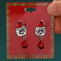 Fashionable Christmas cat drop earrings featuring a Santa hat and red bell dangle. - Bell Christmas Hat Cat (H-141)