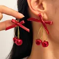 Festive Christmas red ribbon bow and bell drop earrings, stylish SKU variant for holiday wear - Red Bow Double Bell (H-136)